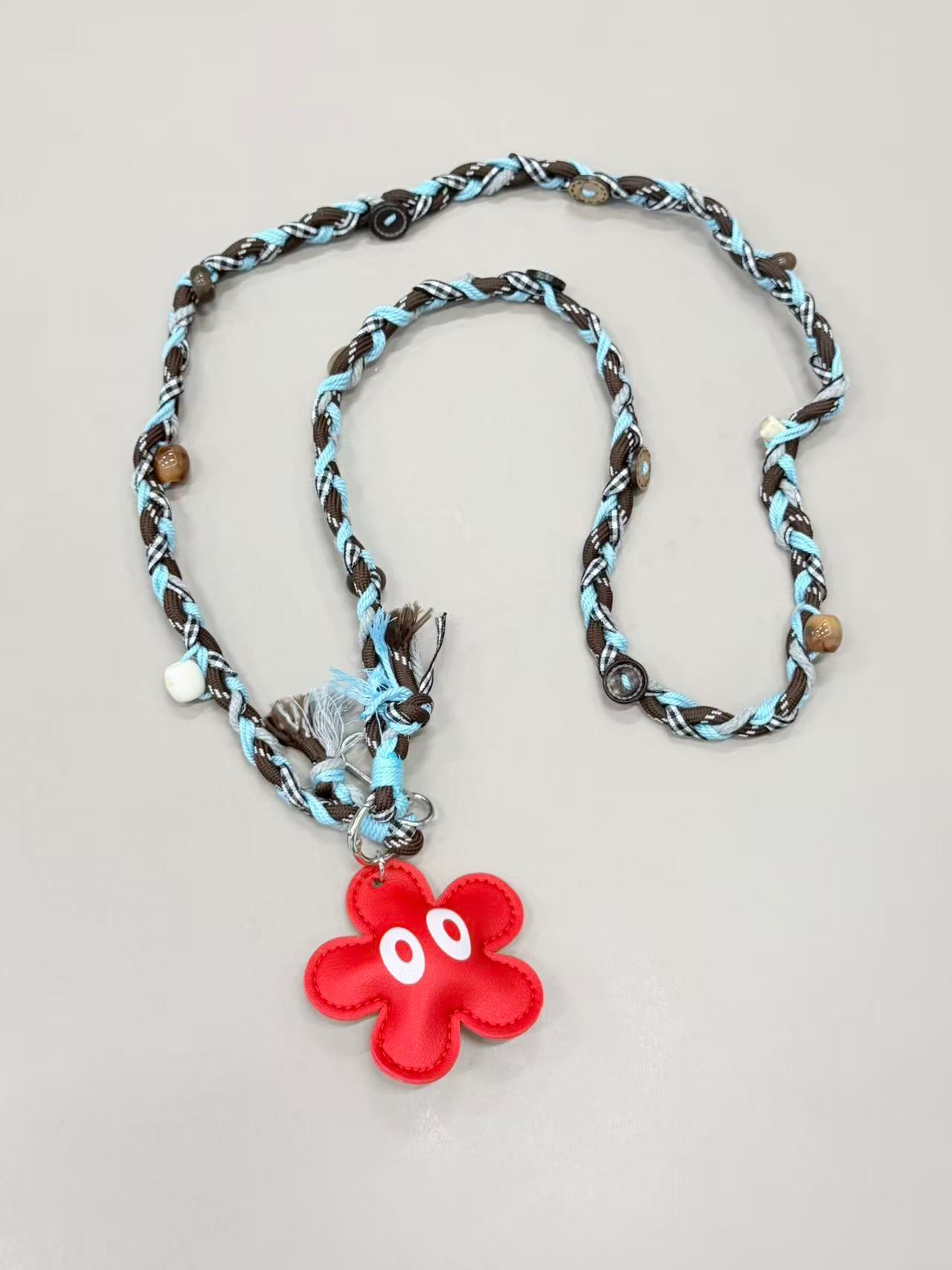 Brown blue braided phone lanyard with flower charm