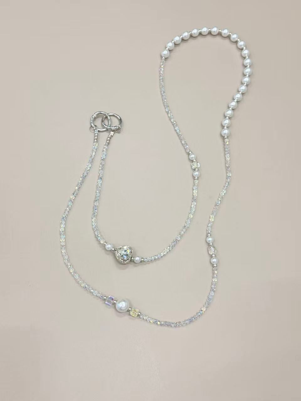 Crystal pearl phone lanyard with blue heart