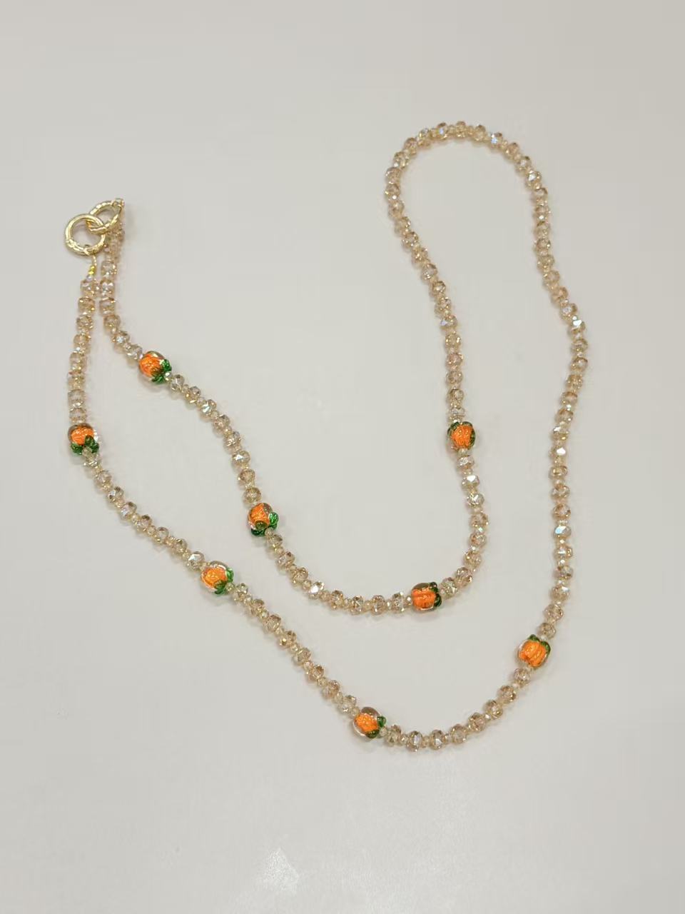 Champagne crystal phone lanyard with citrus