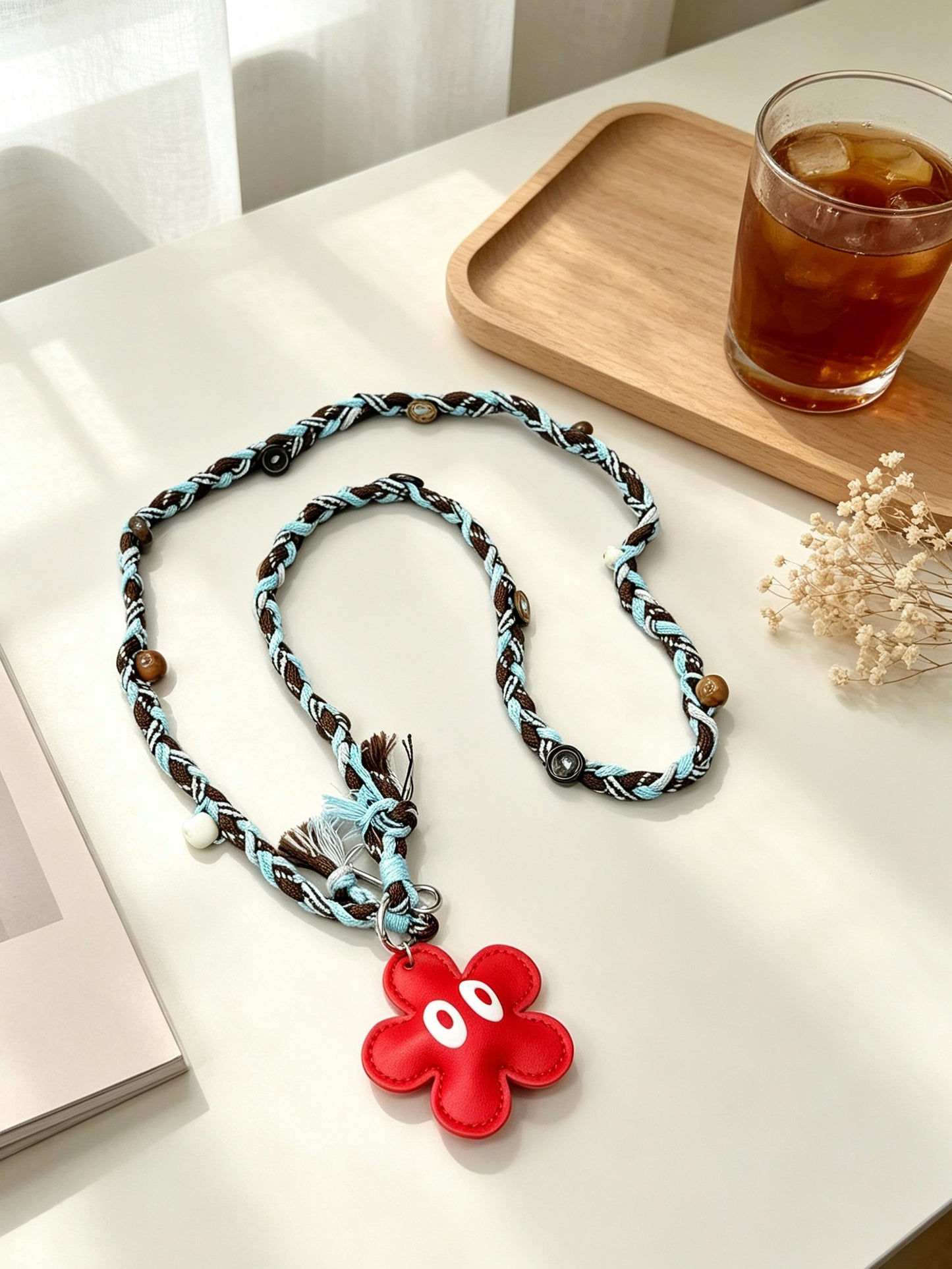 Brown blue braided phone lanyard with flower charm