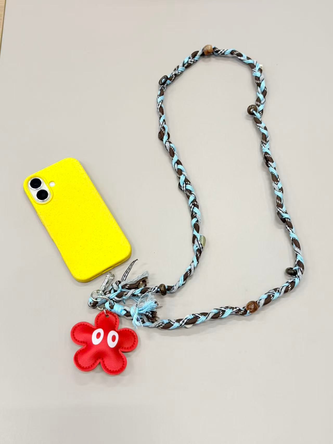 Brown blue braided phone lanyard with flower charm