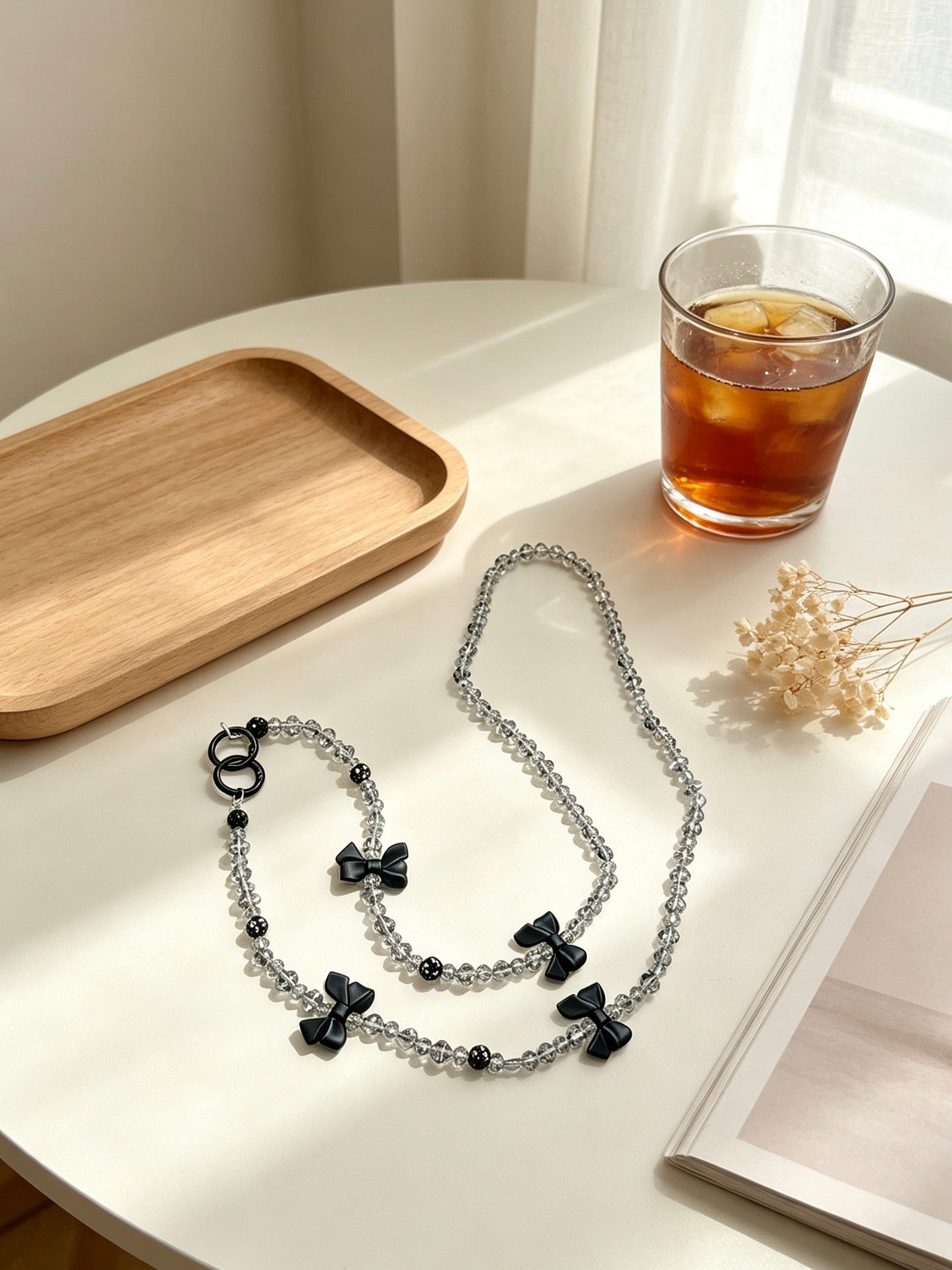 Crystal phone lanyard with black bows
