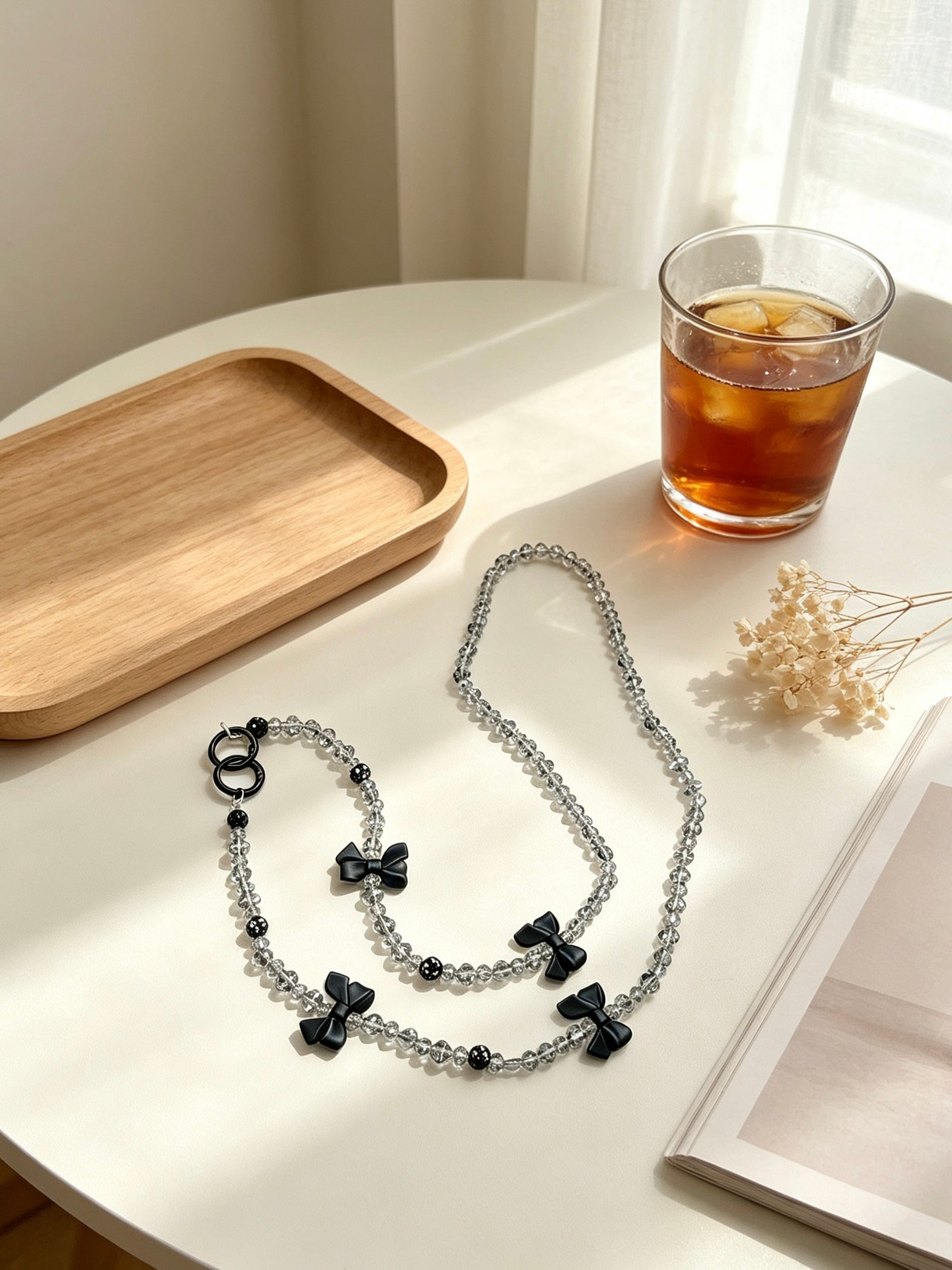 Crystal phone lanyard with black bows