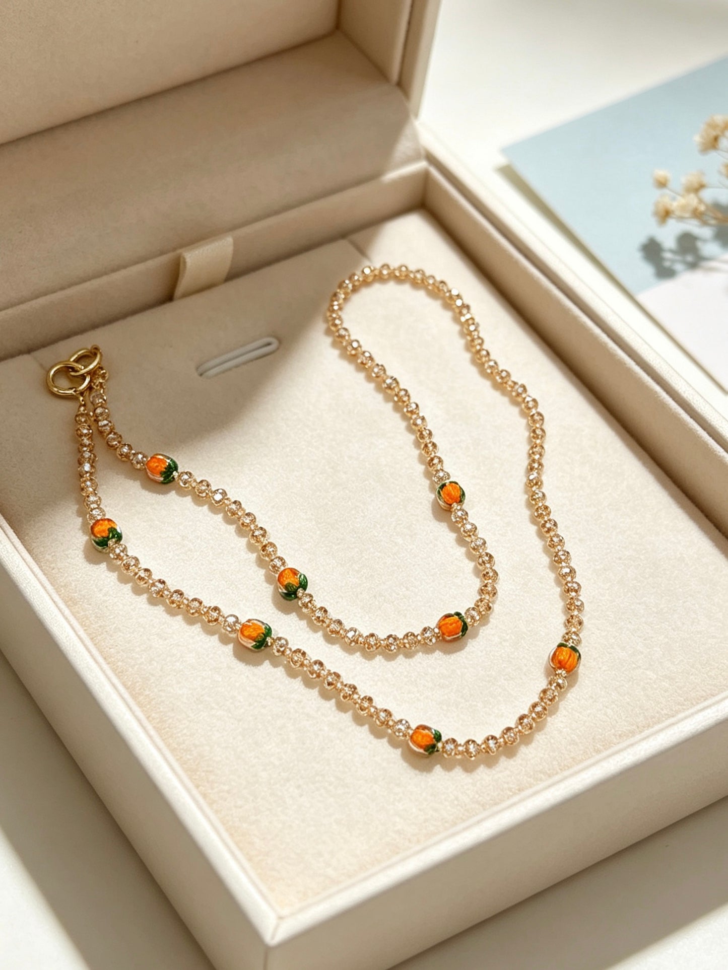 Champagne crystal phone lanyard with citrus