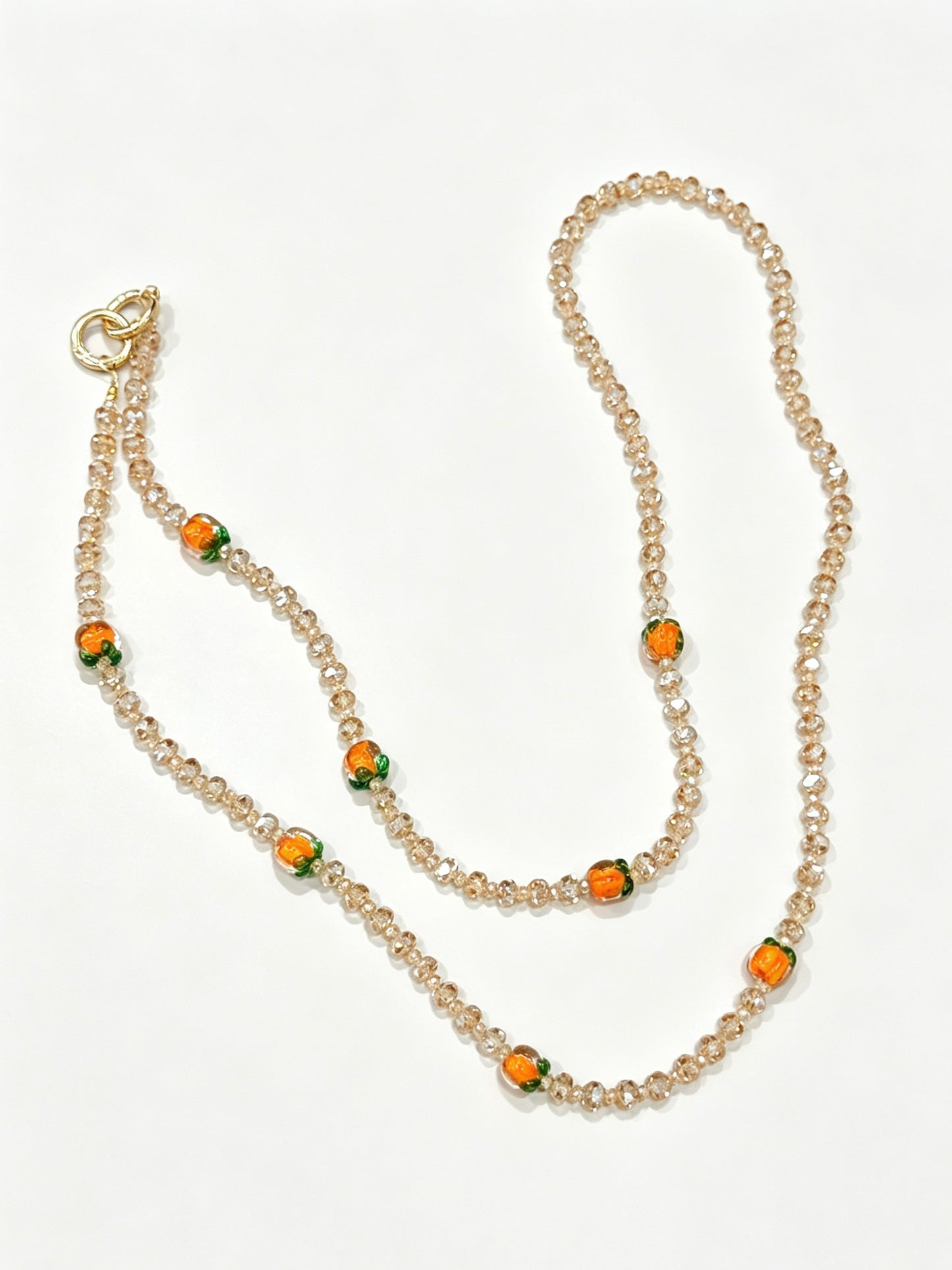 Champagne crystal phone lanyard with citrus