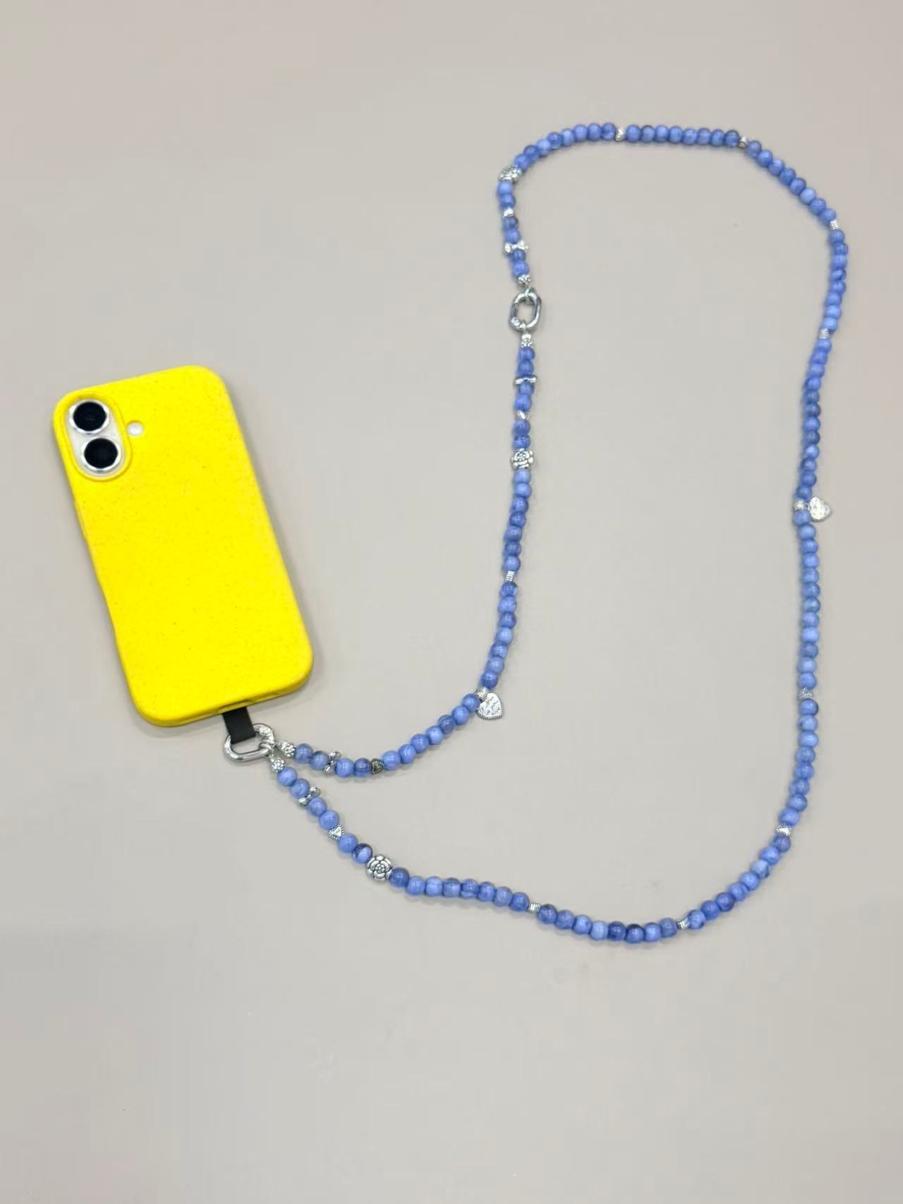 Blue beaded phone lanyard with silver charms